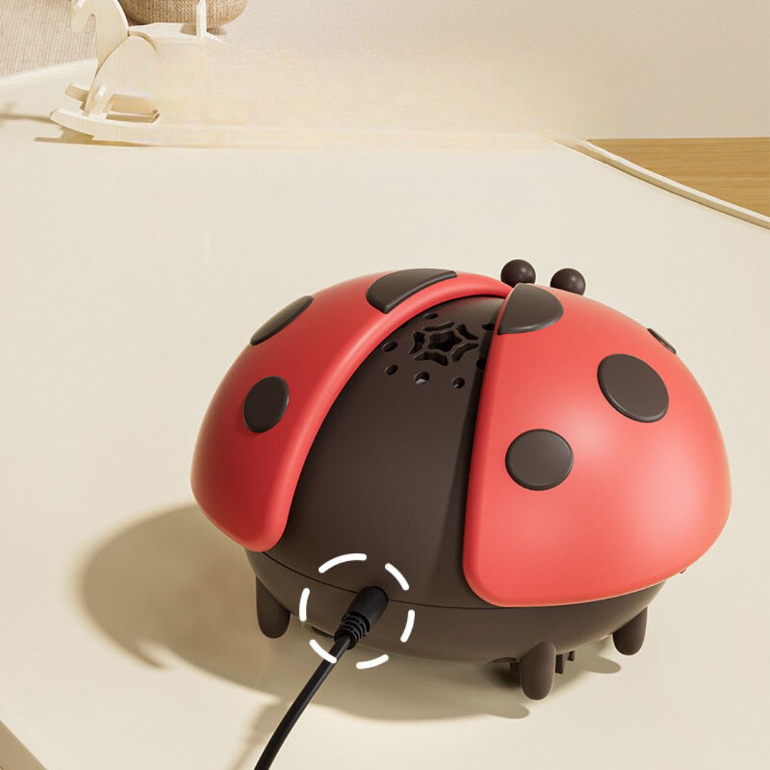 Jouet sensoriel lumineux en forme de coccinelle