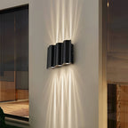 Lampada da parete moderna a LED per esterni a onda con luce rivolta verso l'alto e verso il basso