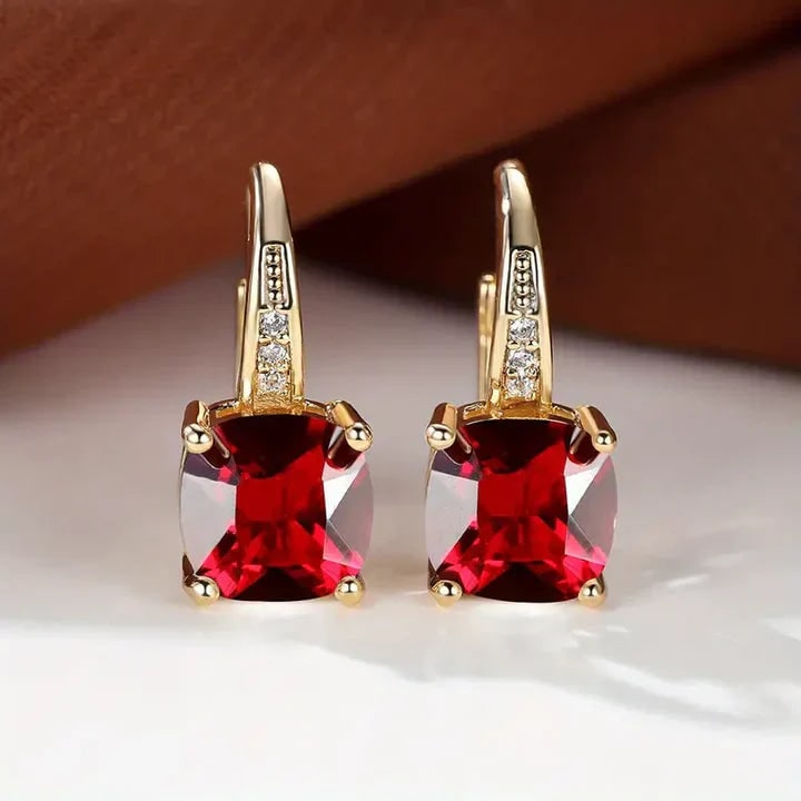 Øreringe med blå ædelsten